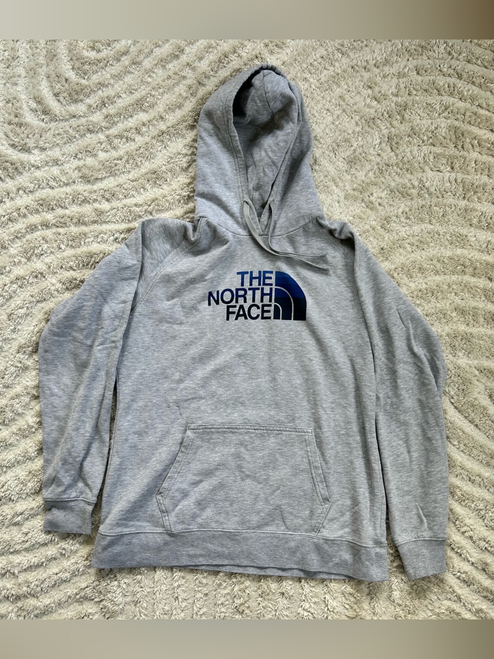 The North Face Women’s Gray Hooded Pullover Sweatshirt with Blue Gradient Logo